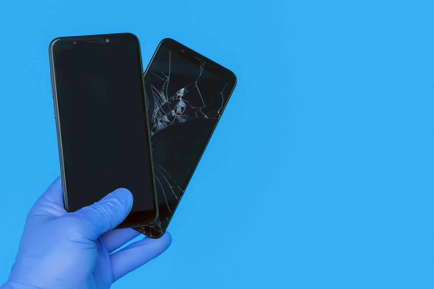 gloved hand holds new smartphone replacing old broken smartphone with cracked screen blue background concept quality smartphone repair service 262398 81