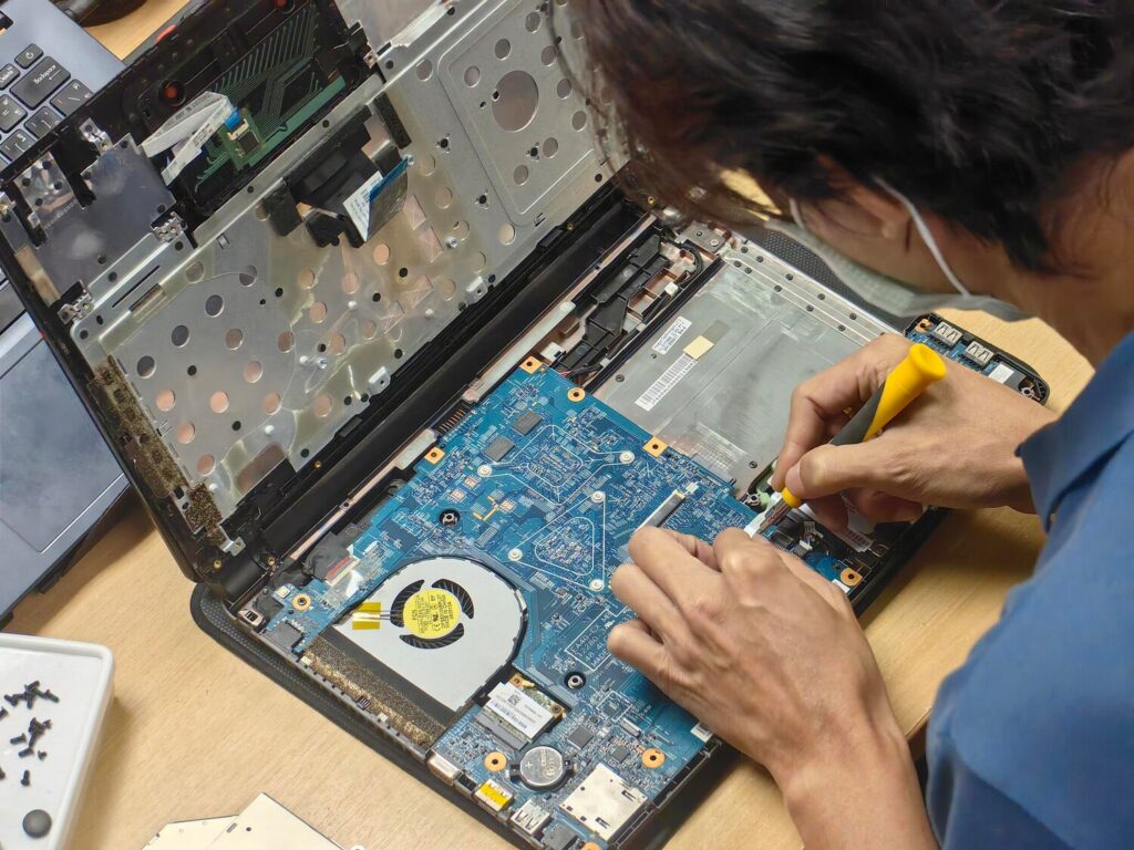 technician repairing laptop motherboard closeup electronic hardware maintenance 228484 7656 technician repairing laptop motherboard closeup electronic hardware maintenance 228484 7656