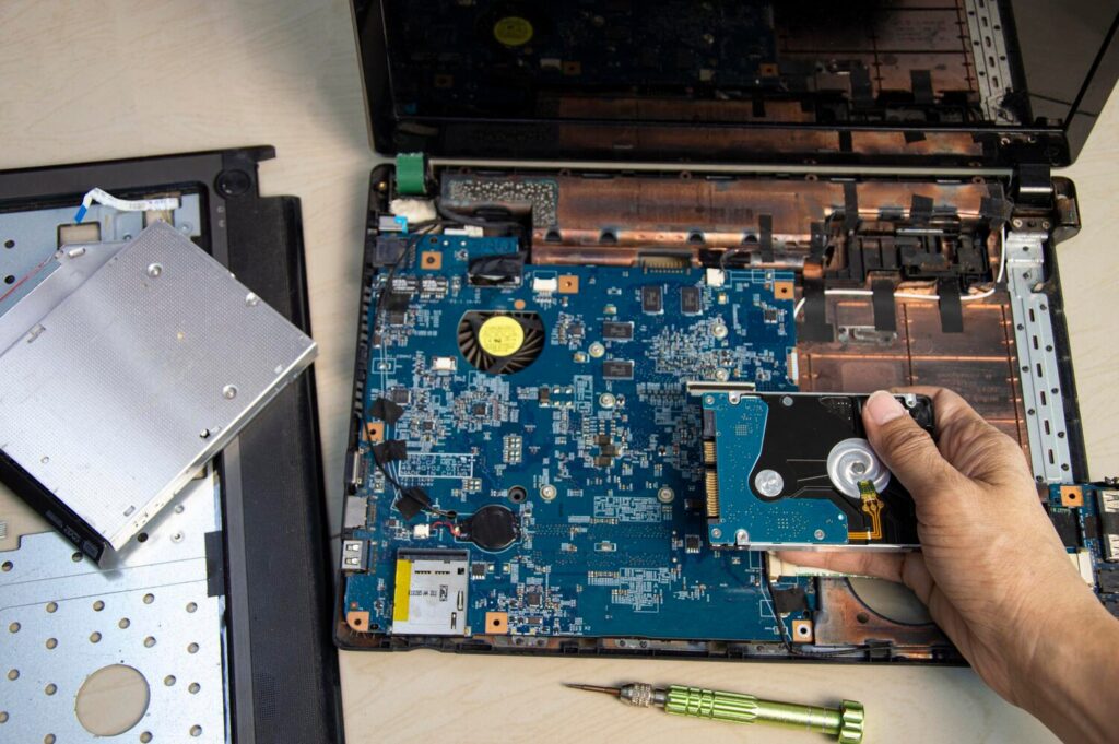 top view mechanic repairing computer notebook hard disk 150418 823 top view mechanic repairing computer notebook hard disk 150418 823