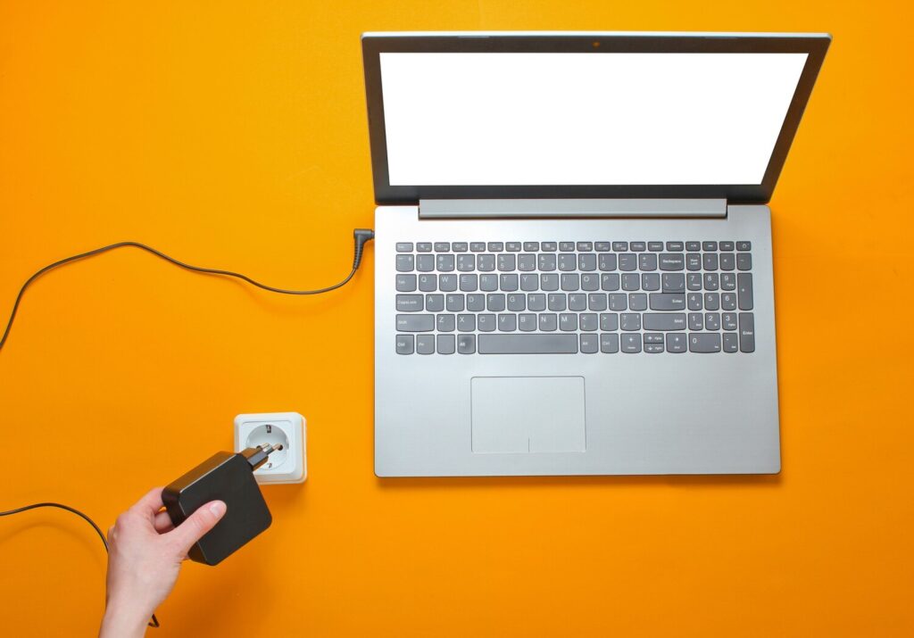 laptop charger electro outlet orange background concept electro addiction top view 175682 13223 laptop charger electro outlet orange background concept electro addiction top view 175682 13223
